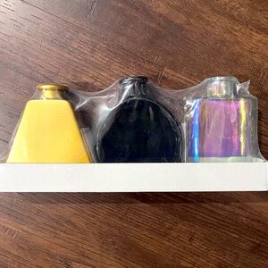 Three glass vases - black, gold and iridescent